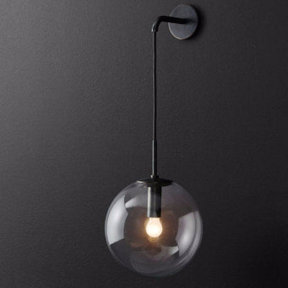 applique murale en verre globe gris fume allumée